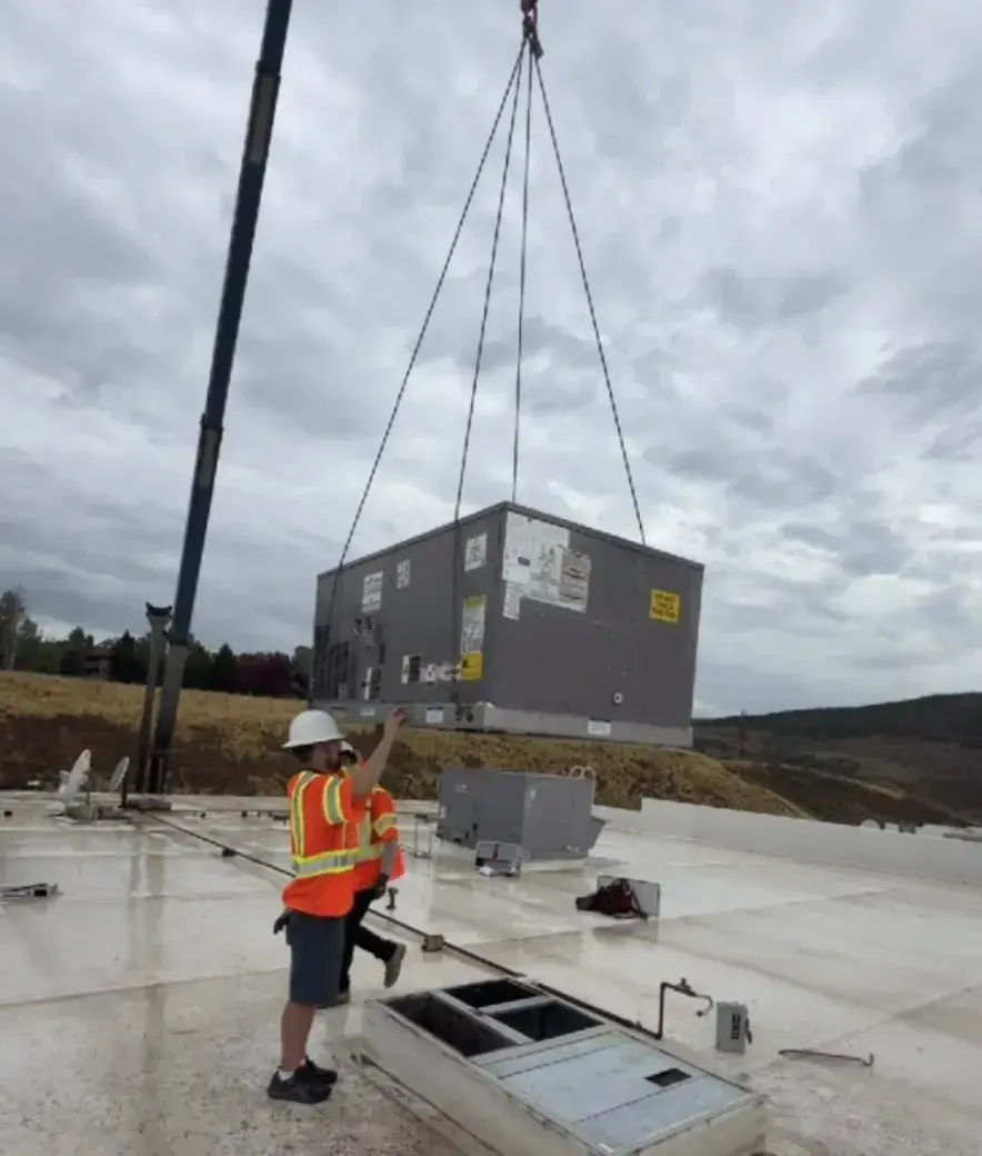 Commercial rooftop unit crane lift on a Snyderville, Utah building by Honest Heating & Cooling
